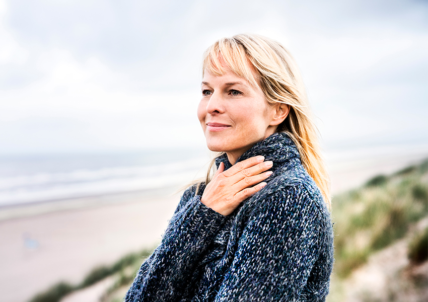 Woman smiling on the beach