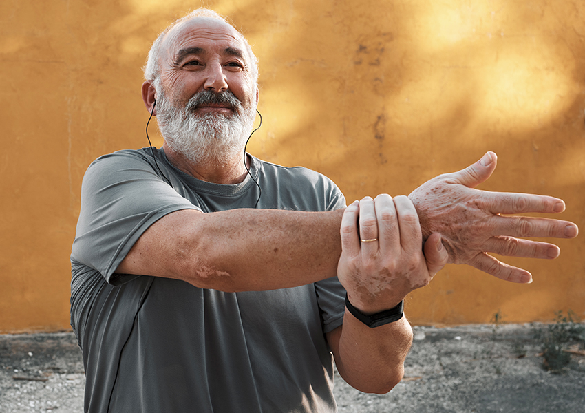 Man stretching shoulder