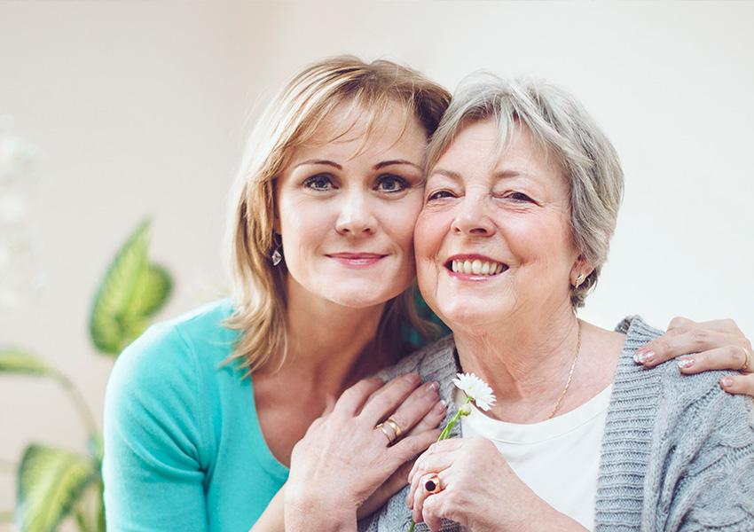 Woman and daughter hugging